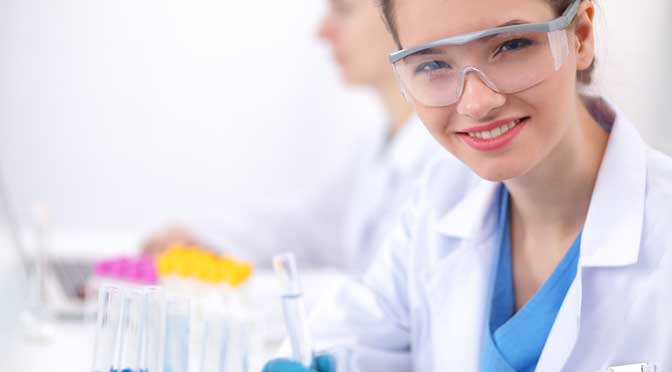 student in lab coat representing colleges with most sicence majors
