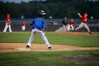 child baseball player representing specializing in a sport to get a scholarship