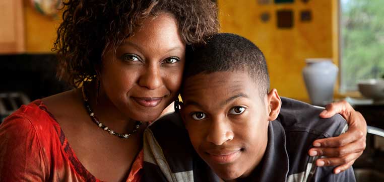 Mother and son representing what high school freshman need to know about paying for college