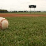 ball on field representing why some don't play college baseball