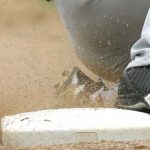 player sliding into base representing college baseball scholarship chances
