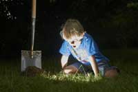 boy digging for buried treasure representing colleges with most generous financial aid