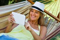 woman in hammock reading about top 50-50 college lists