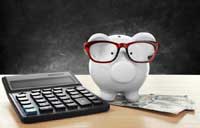 Piggy bank with calculator and money reprenting what you need to know about net price calculators